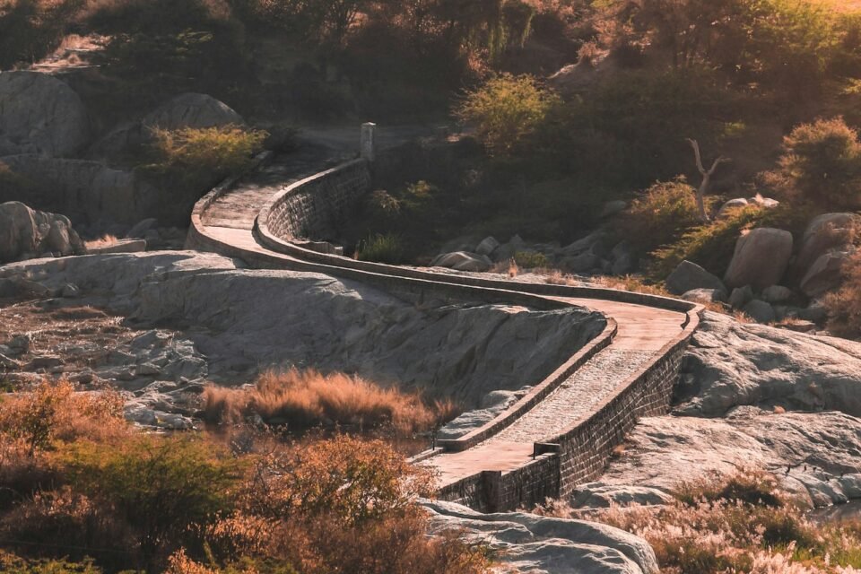 A road through rocky hills near Sawai Madhopur, with things to do nearby